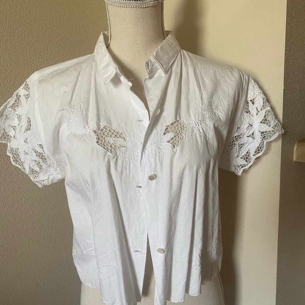 White cropped button up top with lovely laser cut design on sleeves and chest